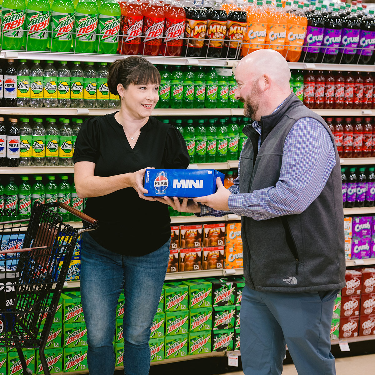 Photo of sales team handing product to a customer